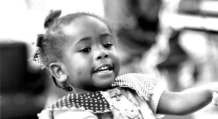 Young girl dancing to the music in Oakland, 1998